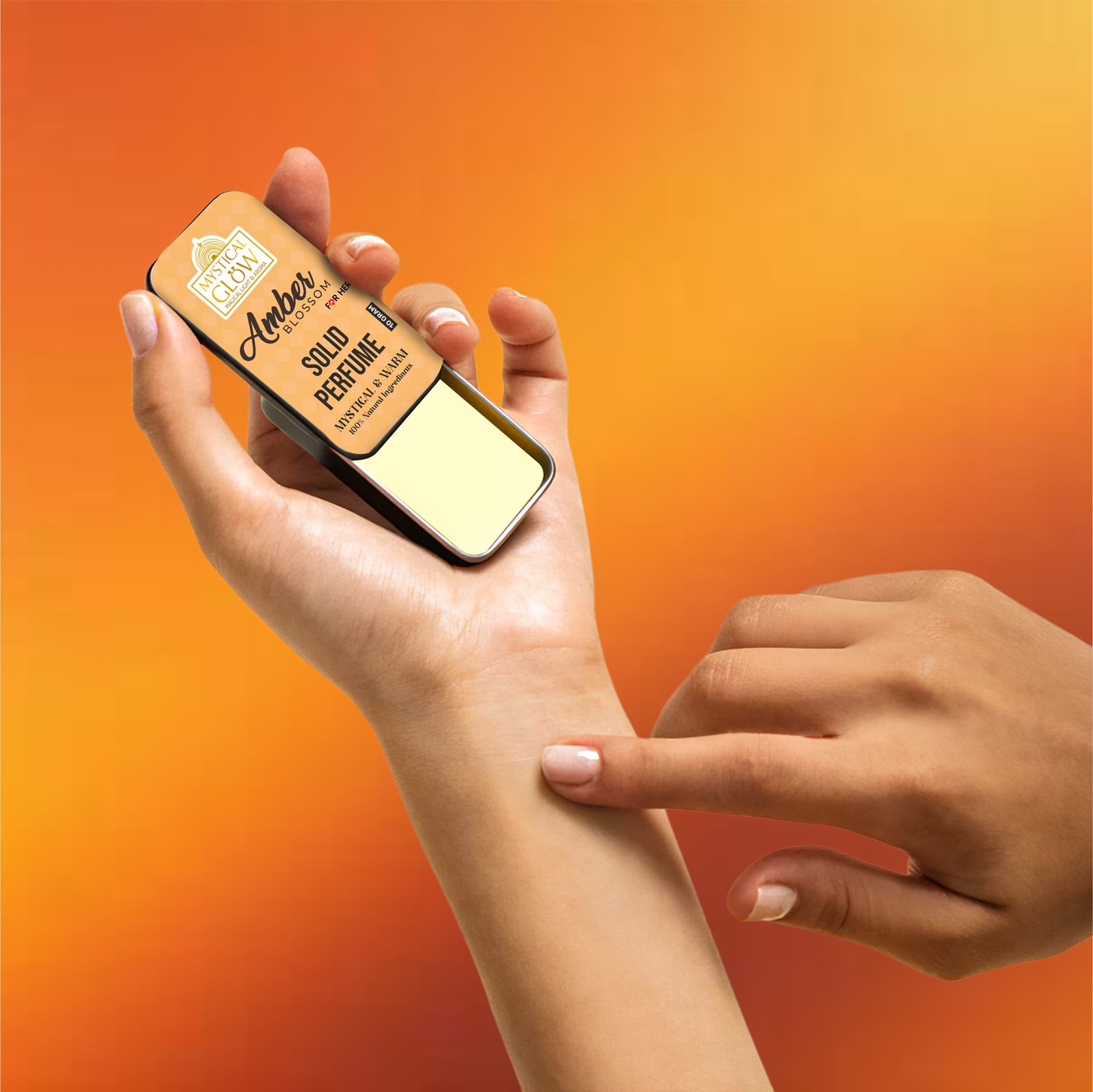 Woman applying Amber Blossom solid perfume on wrist – easy and safe application without sprays.
