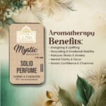 Mystic Wood solid perfume surrounded by visuals of grounding cedarwood, calming sandalwood, and stress-relieving vetiver highlighting aromatherapy benefits.