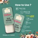 Saffron Musk Solid Perfume tin placed on a round wooden base, surrounded by natural elements like oud chips and saffron strands.